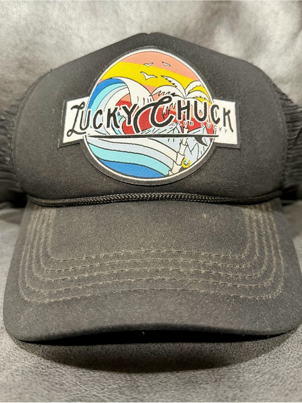 Black Trucker Hat with Colorful Wave Patch